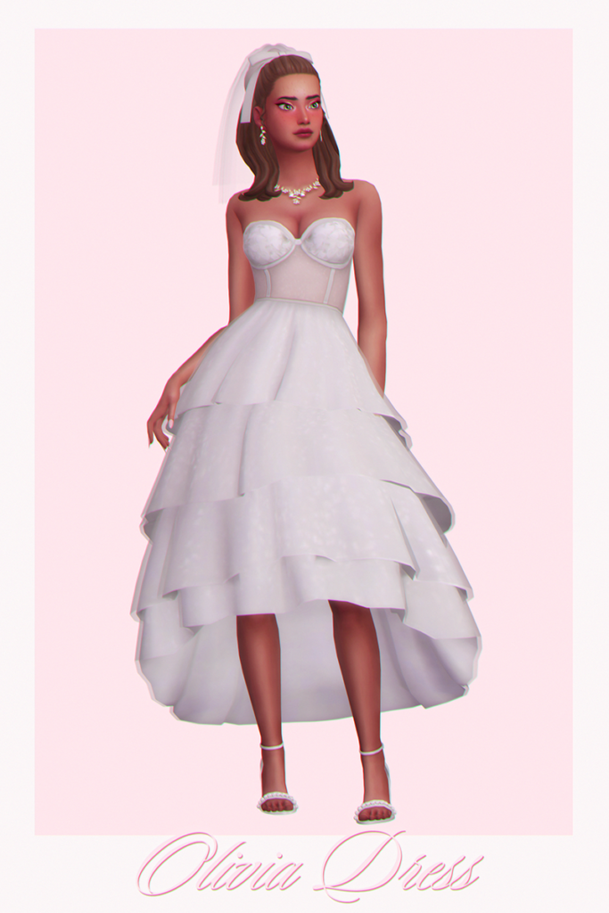 A wedding dress with a layered skirt and a corset top 