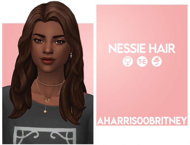 a sim with a necklace and graphic T-shirt wearing cross earrings 