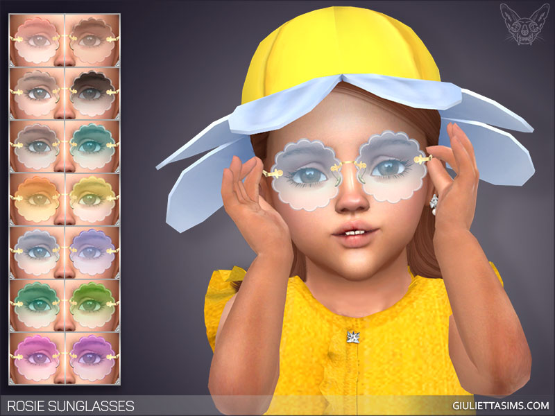 A toddler from The Sims 4 who is wearing a yellow shirt with ruffle sleeves and a yellow daisy hat. They are wearing a pair of cc sunglasses that are bubbled. 