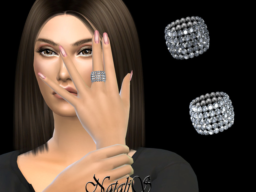 A sim with dark brown hair and pink nails wearing a diamond ring. 