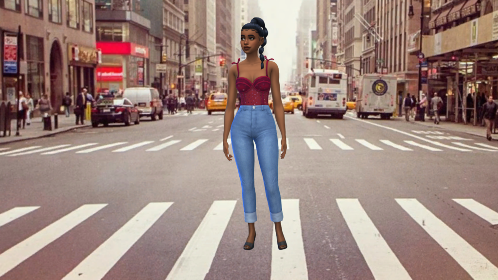 A sim in high waisted blue jeans and a red corset bodysuit with their hair in a braid. The sim is standing in the middle of a crosswalk in a big city.