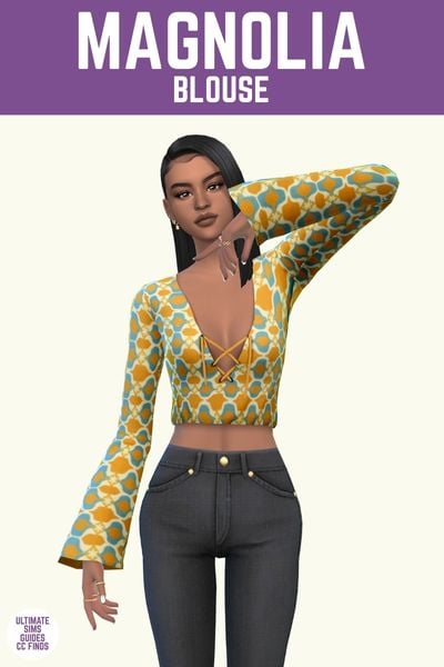This image has a purple bar at the top with white text. The white text says "Magnolia Blouse" and below is a sim with black jeans wearing a cropped long sleeve blouse in a yellow and blue 70s style pattern. 