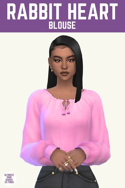 This image has a purple bar at the top with white text. The white text says "Rabbit Heart Blouse" and below is a sim. The sim has brown hair, and is wearing a bright pink blouse. 
