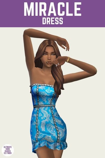 This is a product image for a dress by Trillyke. The image has a purple bar at the top with white text that says "Miracle Dress" the sim below is posed wearing a strapless blue dress with a cute dragon design 