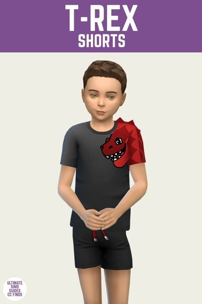 This is a product image for an item from The Playground Set by Joliebean. This image has a purple bar at the top with white text that says "T-Rex Shorts" and below is a male child sim posed. The sim has brown hair and is wearing black shorts and a black t-shirt with a dinosaur on the arm. 