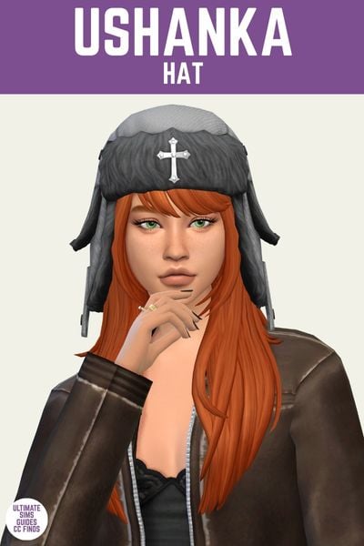 This is a product image for the Axa 2025 cc collection for The Sims 4. This image has a purple bar at the top the text "Ushanka Hat" and below is a sim with red hair wearing a brown leather jacket. The sim is wearing a grey Ushanka Style hat with a silver cross on the front 
