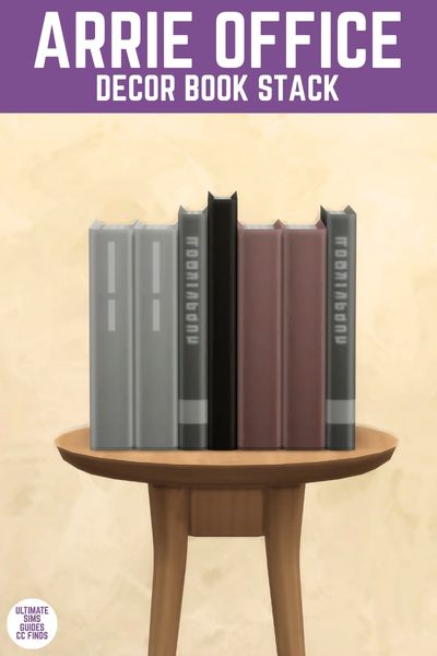 This image has a purple bar at the top that says "Arrie Office Decor Book Stack" and below is a round wooden table with a set of 7 books beside one another. 