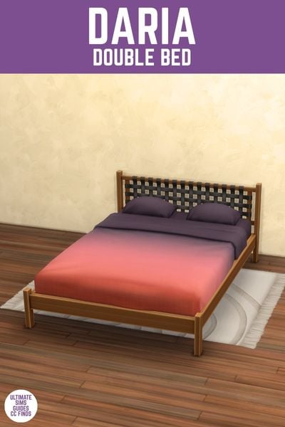 This image has a purple bar at the top with white text that reads "Daria Double Bed" and below is a double bed with a wooden frame and an ombre blanket from purple to orange. 