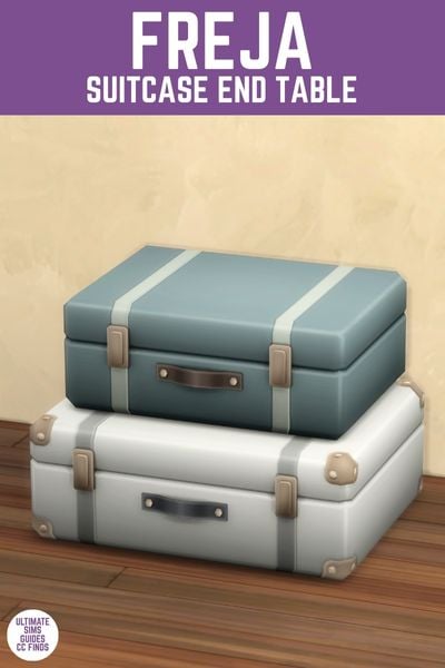 This image has a purple bar at the top with white text that reads "Freja Suitcase End Table" and below is a stack of two old-school suitcases on top of each other 