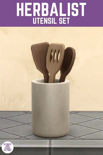 This image has a purple bar at the top with white text that says "Herbalist Utensil Set" and below is a white container with wooden spoons inside 