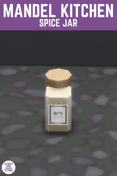 This image has a purple bar at the top with white text that reads "Mandel Kitchen Spice Jar" and below is a black counter with a single spice jar on it 
