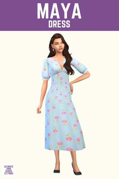 This image has a purple bar at the top that has white text says "Maya Dress" and below is a female sim with brown hair wearing a blue dress with roses all over 
