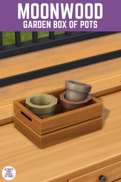 This image has a purple bar at the top with white text that says "Moonwood Garden Box of Pots" and below is a wooden box filled with potted plants